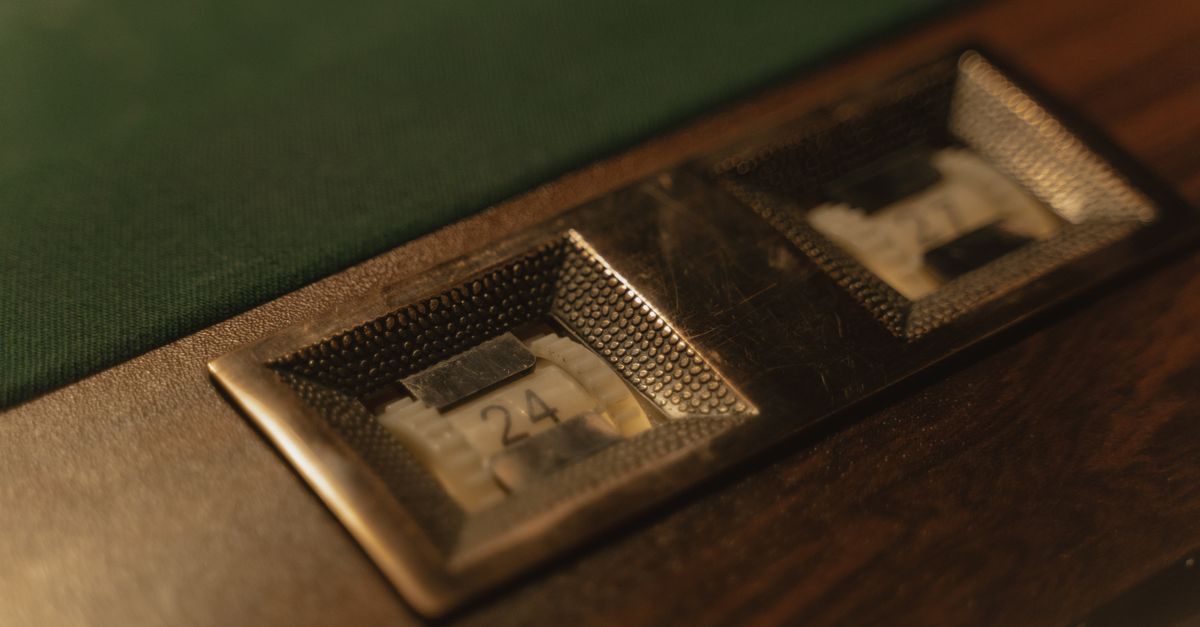 Detailed shot of a vintage pool table score counter with numbers in focus.
